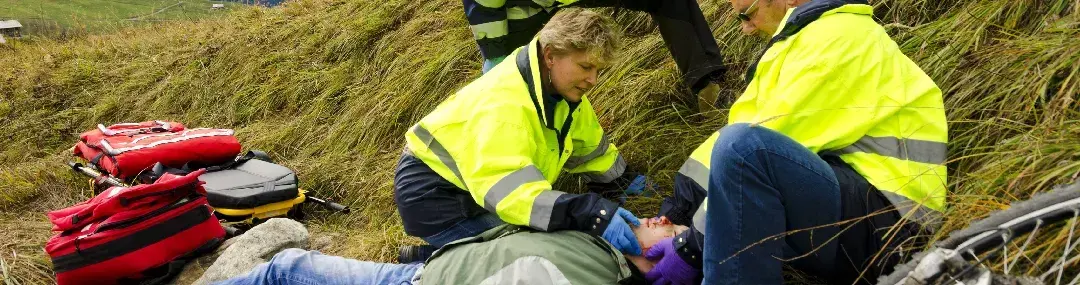 Person practising chest compressions on a dummy